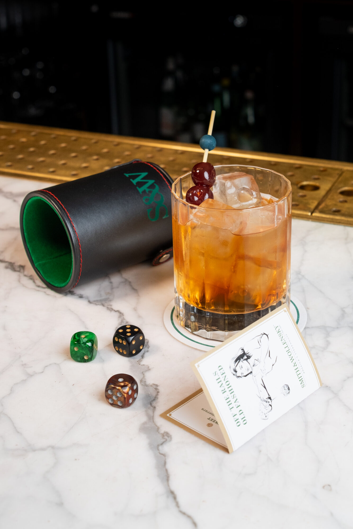 Cocktail next to dice roller