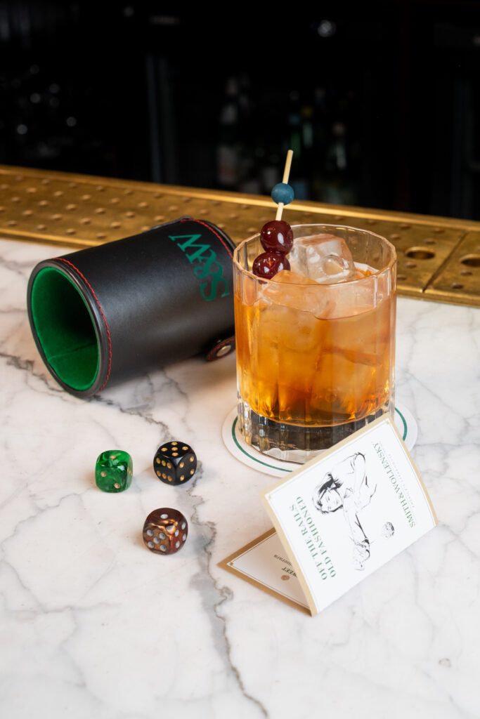 Cocktail next to dice roller